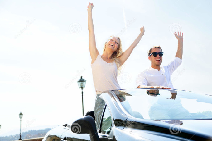 happy-people-car-driving-road-trip-38437918